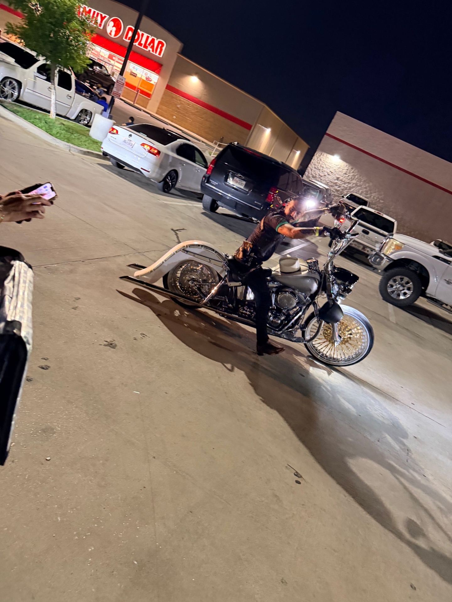 Custom white and chrome bike rider pulling into the meet