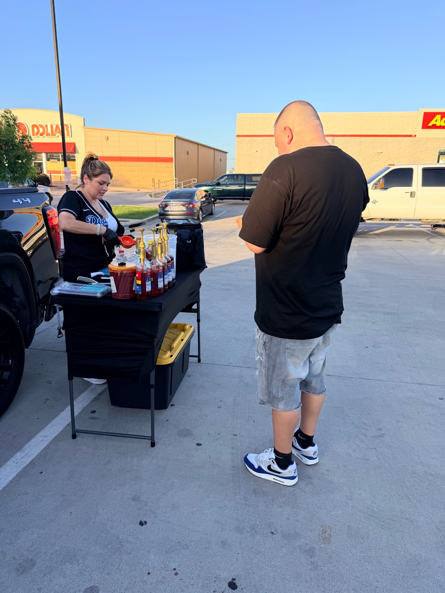 Aguas Güey crew prepping fresh handcrafted aguas frescas at the booth