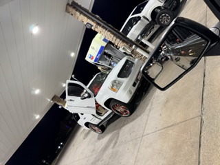 White custom mamalona truck at the Chevron stop during the night meet