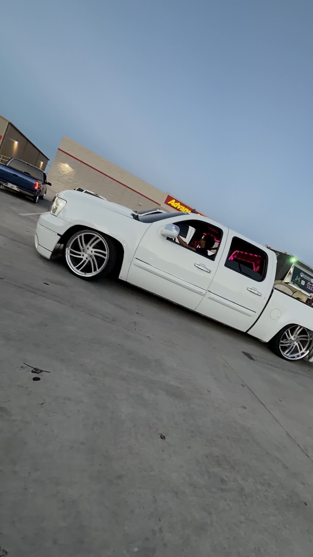 Dropped white crew cab mamalona on polished wheels